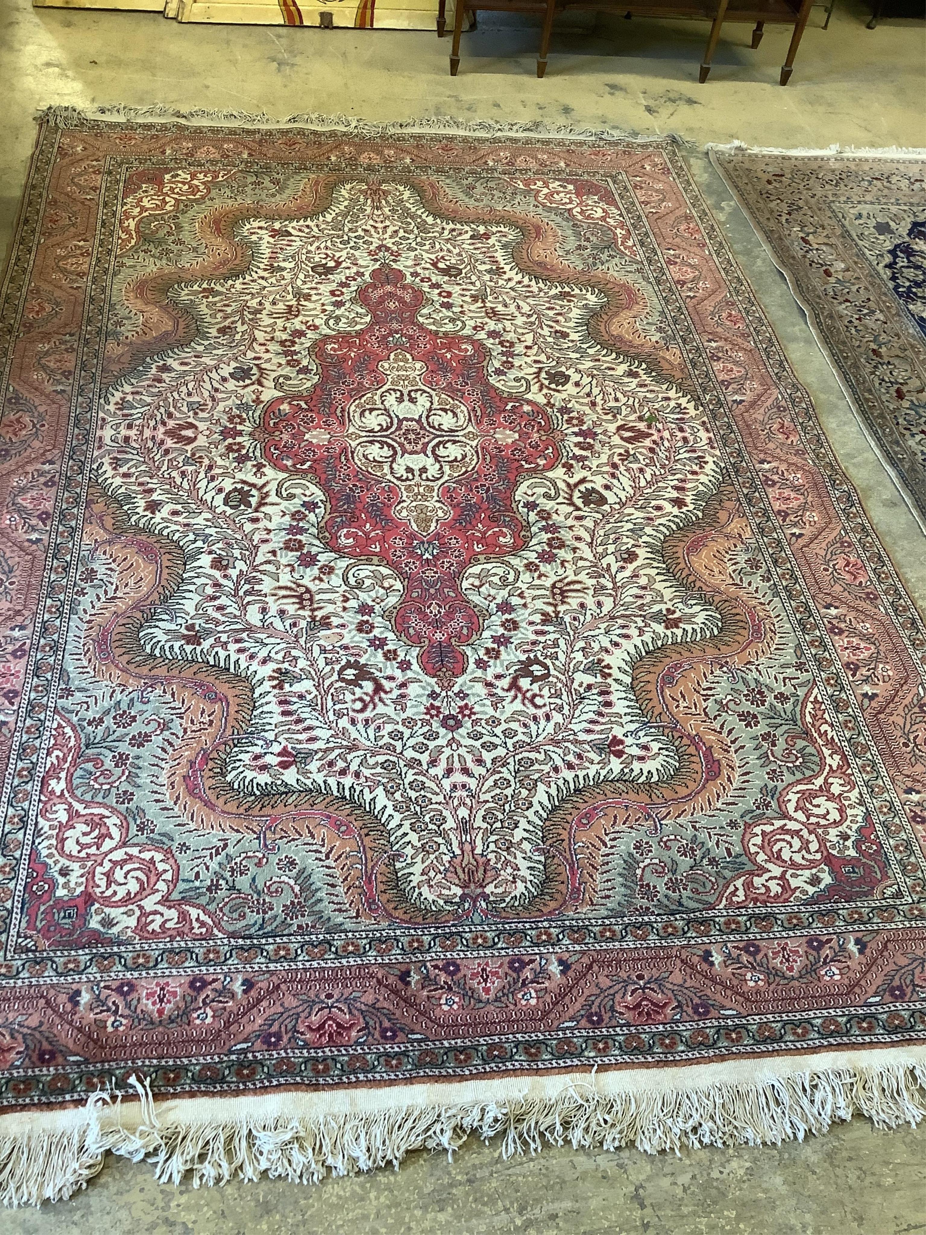 A Persian style beige ground carpet, 290 x 197cm. Condition - fair to good